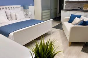 Postel nebo postele na pokoji v ubytování Leonardo50 Apartment