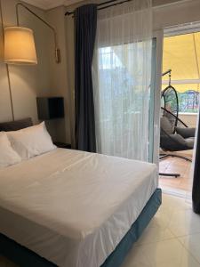 A bed or beds in a room at My Way Hotel