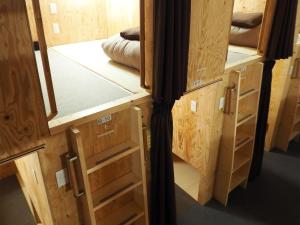 a room with wooden cabinets and drawers at Choine Hotel Sapporo Teine - Vacation STAY 97420v in Sapporo
