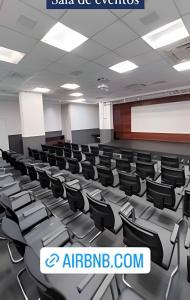 an empty lecture hall with chairs in the middle at Flat hotel 909 RioCentro / Rock inRio / Projac /Farmasi Arena / Barra da Tijuca / rRio de Janeiro in Rio de Janeiro +44 photos