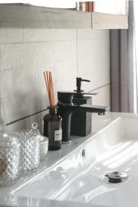 a kitchen counter with a sink in a bathroom at Kavos House in Meyisti