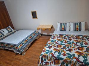 Ένα ή περισσότερα κρεβάτια σε δωμάτιο στο Carolina Hostel
