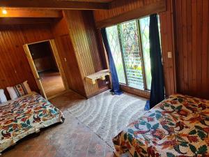Ένα ή περισσότερα κρεβάτια σε δωμάτιο στο Carolina Hostel
