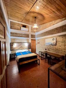 Postel nebo postele na pokoji v ubytování Jardín Café Hotel & Restaurant