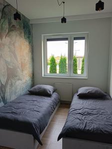 Postel nebo postele na pokoji v ubytování PREMIUM Apartaments