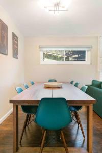 a conference room with a table and chairs at Spacious Luxurious House Big Groups and Pool in Irving