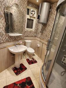 a bathroom with a sink and a toilet at Luxury 2BH with full Cairo Nile view in Cairo +19 photos