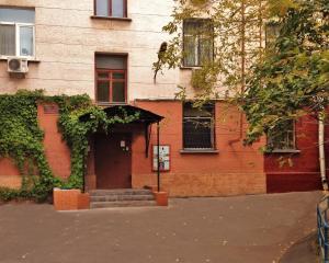 a building with a door and stairs in front of it at ILIAN Hostel in Moscow