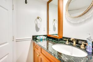 a bathroom with a sink and a mirror at Shared Yard, 4 Mi to NYC Englewood Apartment! in Englewood +16 photos