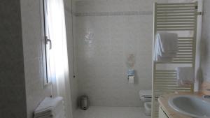 Vannituba majutusasutuses Albergo Al Cacciatore
