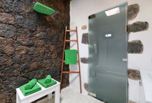 a bathroom with a shower and a ladder at Apartamento Los 4 Nobles in Tinajo +26 photos