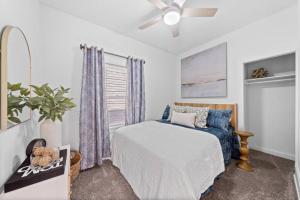 a bedroom with a bed and a ceiling fan at Comfortable 2-Bedroom House In Cleveland 1330 in Cleveland