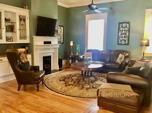a living room with a couch and a table at Viridia Bed and Breakfast in Littleton