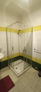 a shower stall in a bathroom with a sink at Jolie Villa vue montagne et piscine privée in Tangier