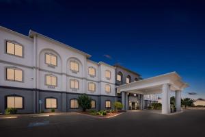 a rendering of the front of a hotel at night at Best Western Palace Inn & Suites in Big Spring