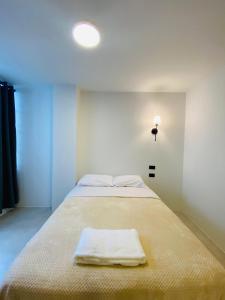 Letto o letti in una camera di Hotel Bombay