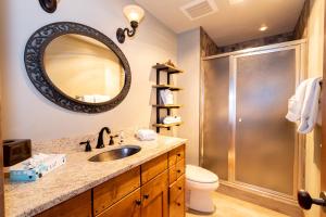 a bathroom with a sink and a shower at 671 Elk Circle by Summit County Mountain Retreats in Keystone +42 photos