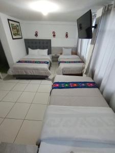 Letto o letti in una camera di HOSTAL La RASA