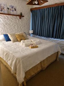 a large bed with a tray on top of it at Departamento Completo Centro Bariloche in San Carlos de Bariloche