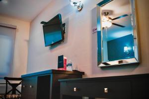 TV a/nebo společenská místnost v ubytování Hotel Maioris Kumate Culiacán