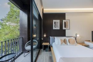 En eller flere senge i et værelse på Cuadra 134 Residencial Condesa