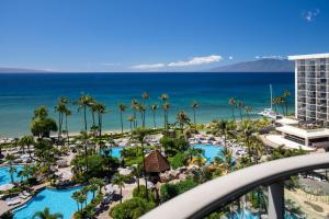 a view of the beach and the ocean from the balcony of a resort at The Westin Maui Resort & Spa, Ka'anapali in Lahaina