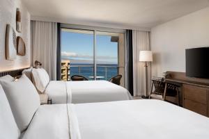 a hotel room with two beds and a view of the ocean at The Westin Maui Resort & Spa, Ka'anapali in Lahaina