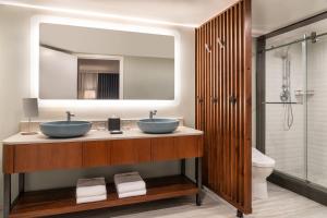 a bathroom with two sinks and a mirror at The Westin Maui Resort & Spa, Ka'anapali in Lahaina