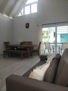 a living room with a couch and a table at Via Sophia in Negril