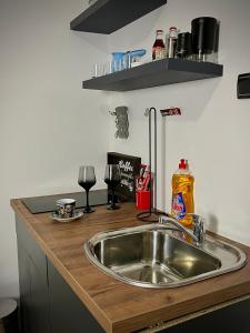 Kuchyň nebo kuchyňský kout v ubytování Apartment Code