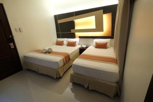 Voodi või voodid majutusasutuse Southpole Central Hotel toas