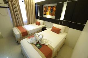 Voodi või voodid majutusasutuse Southpole Central Hotel toas