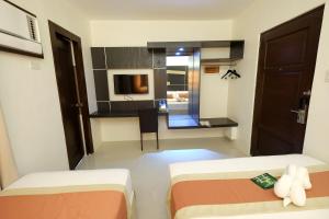 Voodi või voodid majutusasutuse Southpole Central Hotel toas