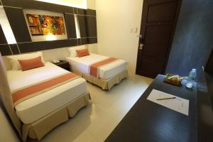Voodi või voodid majutusasutuse Southpole Central Hotel toas
