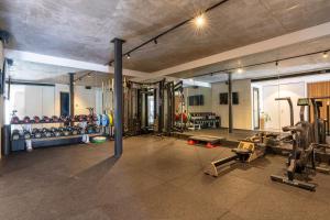 a gym with a lot of equipment in a room at Bunker House, Gerringong in Gerringong