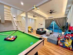 a living room with a pool table at Kampung8 17pax Snooker Arcade in Melaka