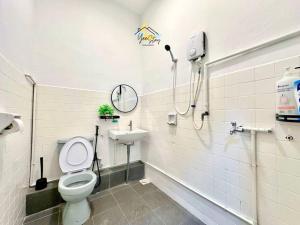 a bathroom with a toilet and a sink at Kampung8 17pax Snooker Arcade in Melaka +52 photos