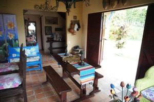 a living room with a table and a couch at Casa Familiar y Naturaleza en Parcelación Privada in Amagá
