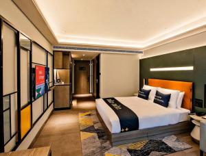 Ένα ή περισσότερα κρεβάτια σε δωμάτιο στο MUSTEL Hotel of Beijing Mentougou