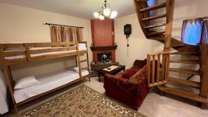 a living room with two bunk beds and a couch at Mountain View - Full Villa in Polydrossos