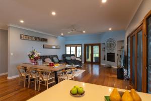a living room with a couch and a table at Family Camping Paradise with Kangaroos and Nature in Greta