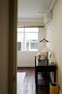 a room with a desk and a window at Nap by Snooze in Bangkok