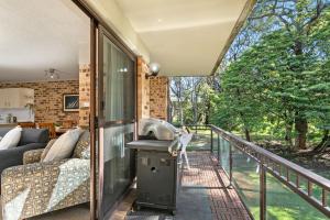 an internal view of a house with a balcony at Bay Parklands 44 WI FI Netflix Air Con and Views in Nelson Bay