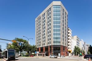 a tall building on a city street with at The knot Sapporo - Vacation STAY 96522v in Sapporo