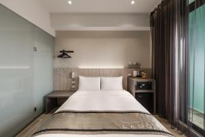 Postel nebo postele na pokoji v ubytování Hotel YAM LAGOM