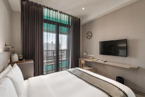Postel nebo postele na pokoji v ubytování Hotel YAM LAGOM