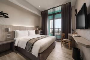 Postel nebo postele na pokoji v ubytování Hotel YAM LAGOM