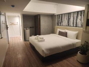 Postel nebo postele na pokoji v ubytování Gecko EYE Hotel