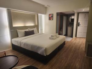 Postel nebo postele na pokoji v ubytování Gecko EYE Hotel