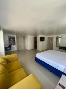 Postel nebo postele na pokoji v ubytování Hotel Hernández CTG